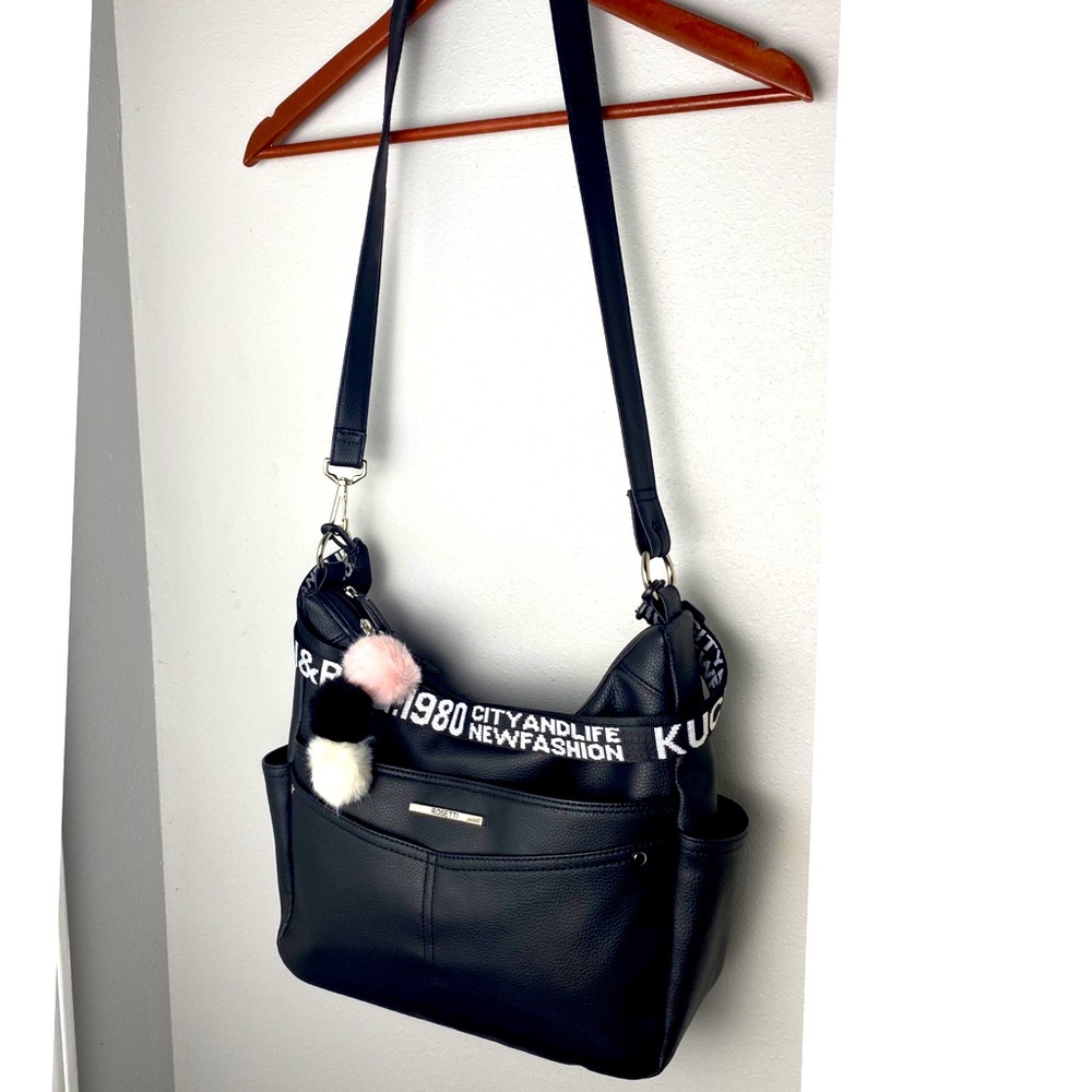 Purse with guitar strap and purse charms accessor. Rosetti crossbod shoulder bag
